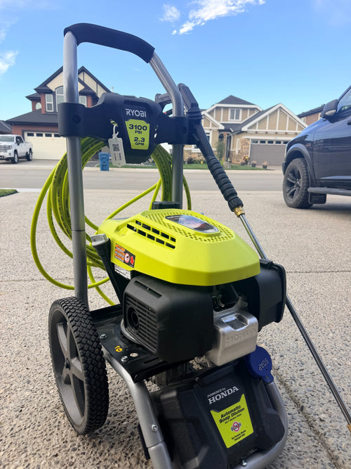 RIVET reusable hanging QR tag on a pressure washer